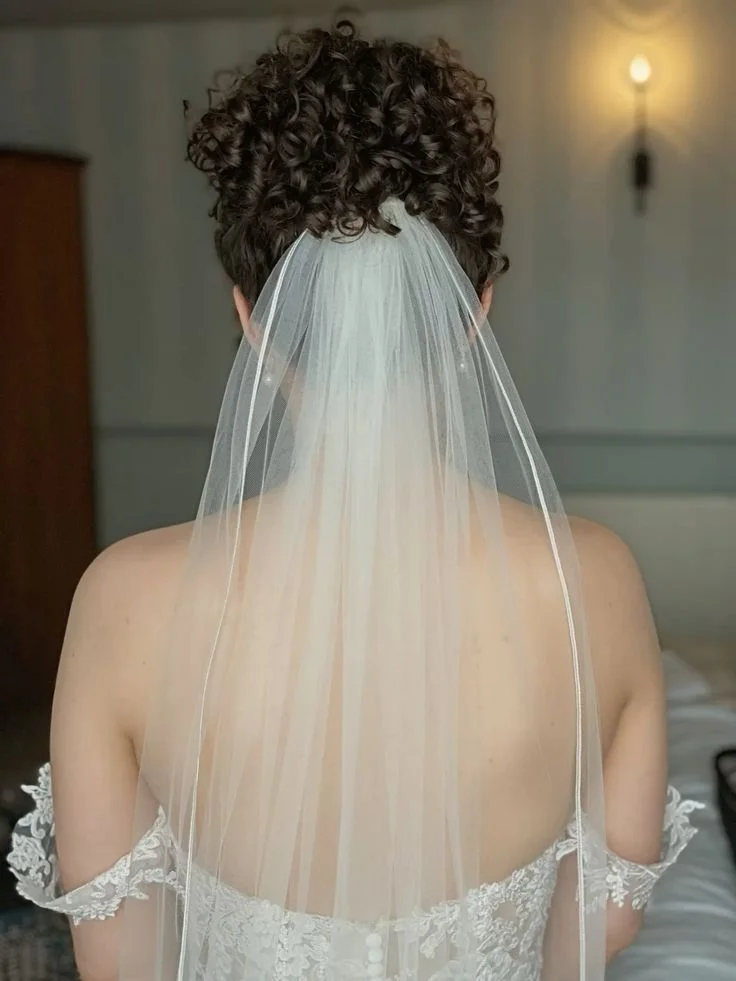 Curly High Bun with Veil